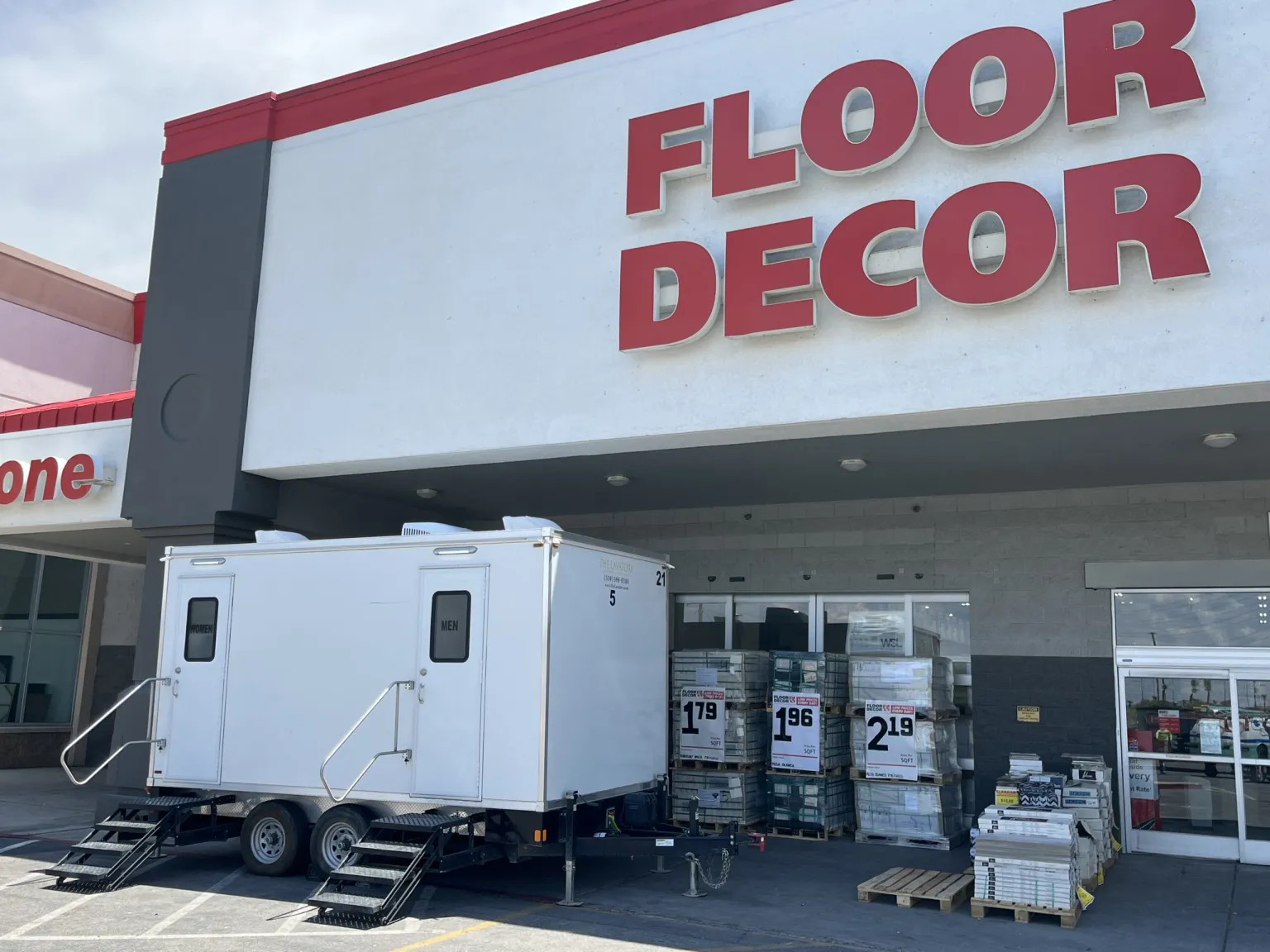 The Lavatory restroom trailer at Floor & Decor. In-store renovation customer-facing trailer
